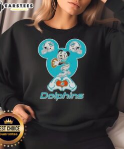 Good Mickey hands forming a heart on a Miami Dolphins football sweatshirt, perfect for fans and casual wear.