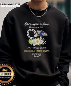 Alt Text: Girl wearing 'Once Upon A Time' sweatshirt with horses and Baltimore Ravens design, showcasing her love for sports and animals.