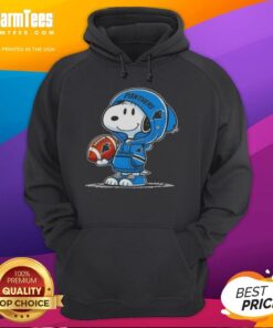 Snoopy wearing a Carolina Panthers hoodie, smiling at fans in a vibrant setting, showcasing the Good Peanuts collection.