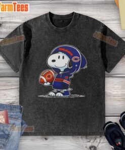 Alt Text: Snoopy in a Chicago Bears hoodie smiling at fans, featured on a washed T-shirt, showcasing good peanuts design.
