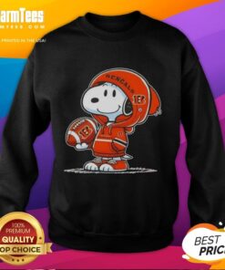 Snoopy in a Cincinnati Bengals hoodie smiles at fans, showcasing the Good Peanuts sweatshirt in a fun, playful setting.