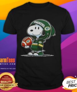 Alt Text: Snoopy in a Green Bay Packers hoodie smiling at fans on a fun Good Peanuts T-shirt design.