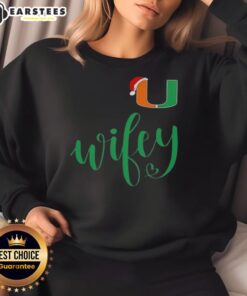 Good Wifey Miami Hurricanes sweatshirt with Santa hat for a festive Merry Christmas celebration.
