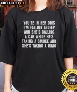 Good You're In Her DMs Ladies Tee featuring a graphic of a woman calling a cab while falling asleep, perfect for casual wear.