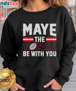 Happy Drake Maye wearing New England Patriots sweatshirt with 'May the Force Be With You' slogan, showcasing team spirit.