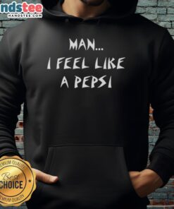 Happy man wearing a 'I Feel Like A Pepsi' hoodie, smiling outdoors, showcasing vibrant streetwear style.