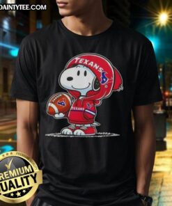 Alt Text: Happy Peanuts Snoopy in a Houston Texans hoodie smiles at fans on a vibrant t-shirt, showcasing team spirit.