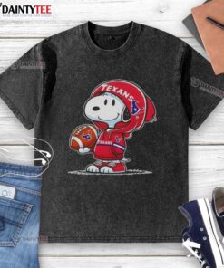 Happy Peanuts Snoopy in a Houston Texans hoodie smiles at fans, showcasing a washed t-shirt design.