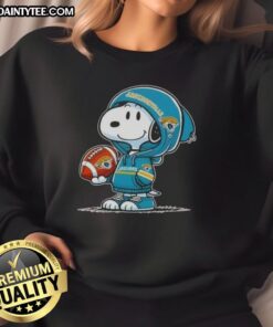 Happy Peanuts Snoopy in a hoodie, smiling at fans while wearing Jacksonville Jaguars sweatshirt.