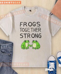 Happy Portland frogs together strong on a washed t-shirt, showcasing vibrant colors and playful design.