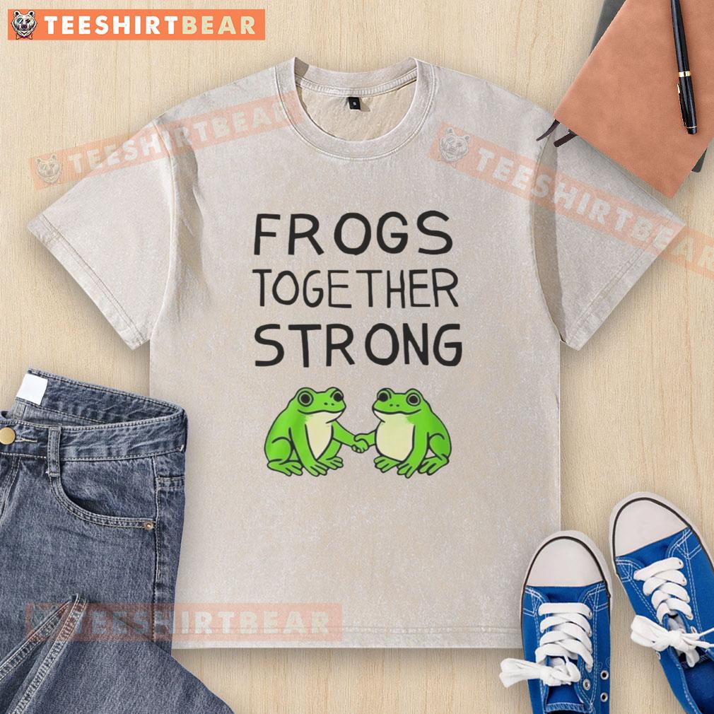 happy-portland-frogs-together-strong-washed-t-shirt Happy Portland frogs together strong on a washed t-shirt, showcasing vibrant colors and playful design.