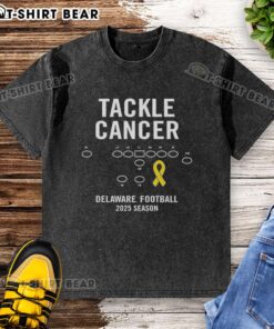 Alt Text: Happy Tackle Cancer Delaware Football 2025 Season washed t-shirt featuring vibrant colors and team logo design.