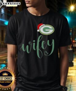 Alt Text: Happy Wifey wearing a Green Bay Packers Santa hat and Merry Christmas T-shirt, celebrating the holiday season.