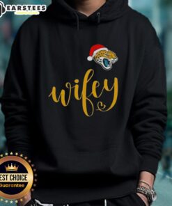 Happy Wifey in a Jacksonville Jaguars hoodie with a Santa hat, celebrating Merry Christmas cheerfully.