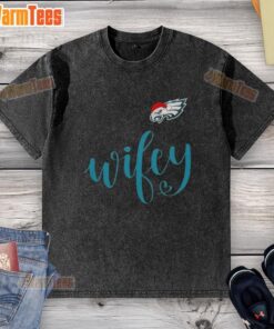 Alt Text: Happy Wifey wearing a Philadelphia Eagles Santa Hat and Merry Christmas washed t-shirt, celebrating the holiday season.