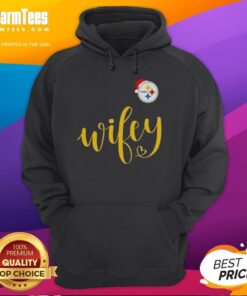 Happy woman in a Pittsburgh Steelers hoodie and Santa hat, celebrating Christmas with festive cheer.