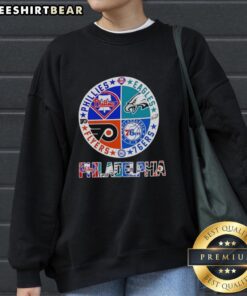 Alt Text: Hot Philadelphia Sport Teams sweatshirt featuring circle logos of Phillies, Eagles, 76ers, and Flyers.