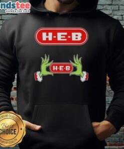 Festive Nice Grinch Hands on a cozy H-E-B Christmas hoodie, perfect for holiday cheer and seasonal gatherings.