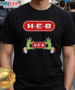 Nice Grinch hands holding a heart on an H-E-B Christmas T-shirt, perfect for holiday cheer and festive spirit.