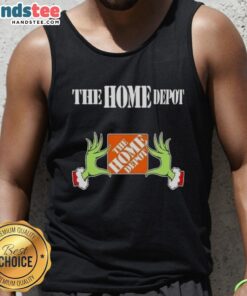 Festive Grinch hands with a heart, showcasing a Home Depot Christmas tank top, perfect for holiday cheer and style.