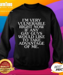 Model wearing 'Nice I'm Very Vulnerable' sweatshirt, inviting connection with gay guys in a casual, friendly setting.