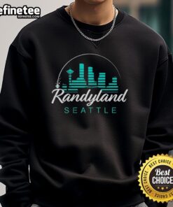 Alt Text: Randy Arozarena in a Seattle Mariners sweatshirt at Randyland, showcasing team spirit and vibrant colors.