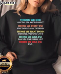 Cozy 'Nice Things We Did, Didn't Want, Will Won't Do' sweatshirt displayed on a wooden background, perfect for casual wear.