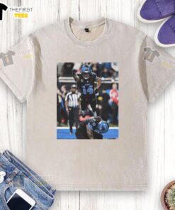 Official Detroit Lions Spiderman Amon-Ra St. Brown Superman t-shirt featuring a vibrant graphic design.
