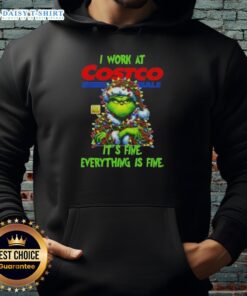 Alt Text: Cozy Official Grinch Christmas Tree hoodie from Costco Wholesale, featuring the phrase I work at it's fine, everything is fine.