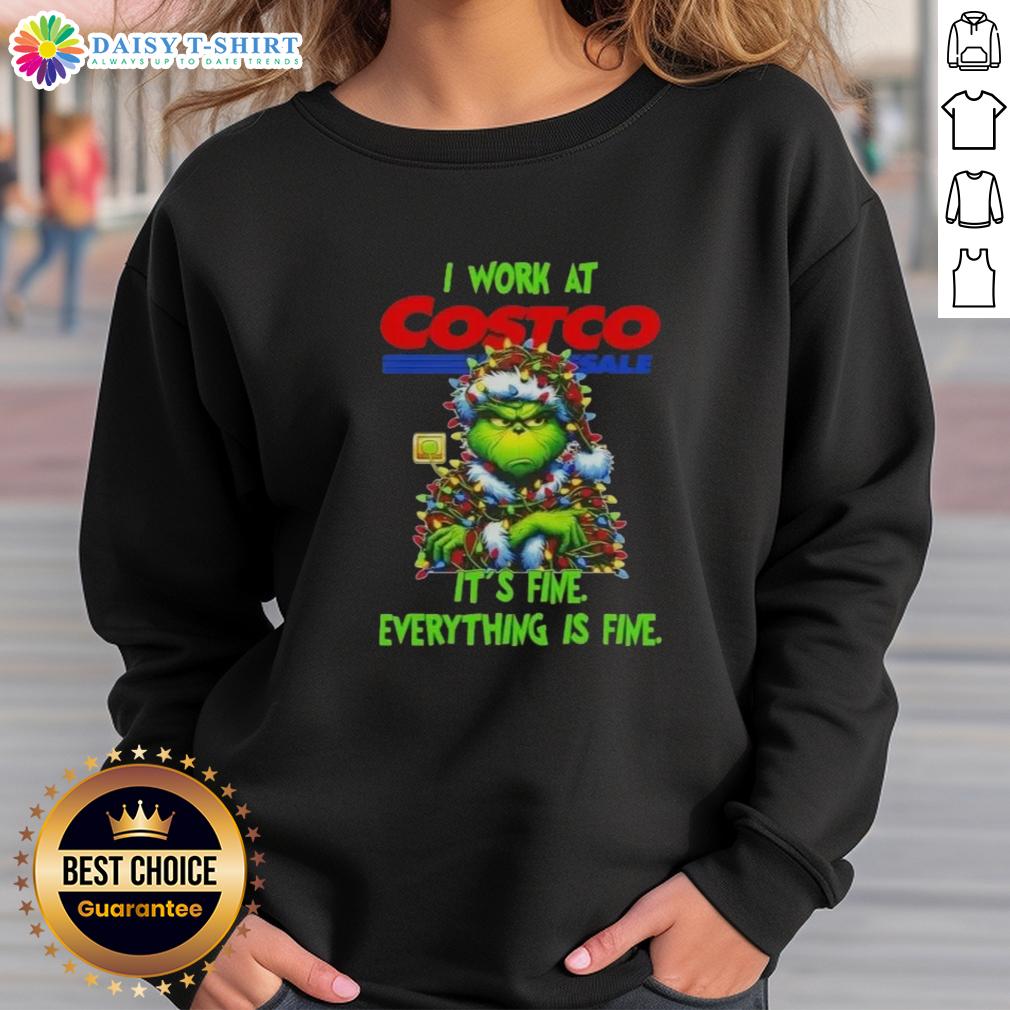 Official Grinch Christmas Tree X Costco Wholesale I Work At It's Fine Everything Is Fine Sweatshirt Alt Text: Official Grinch Christmas Tree sweatshirt from Costco Wholesale featuring the phrase 'I Work At It's Fine Everything Is Fine'.