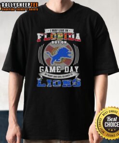 Official I May Live In Florida But On Game Day Detroit Lions Football T-Shirt featuring bold team graphics.