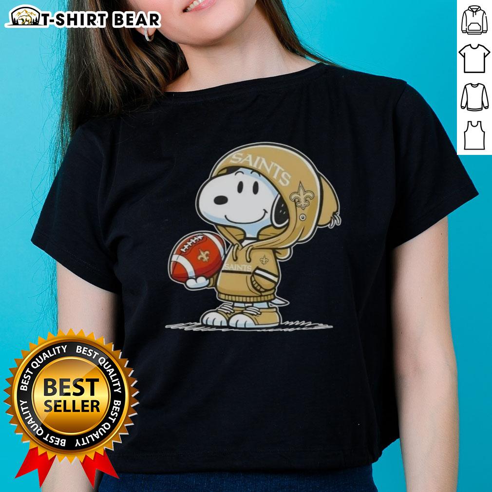 Official Peanuts Snoopy Wearing Hoodie New Orleans Saints And Smilling At Fans Ladies-Tee Snoopy in a hoodie, smiling at fans, showcasing the New Orleans Saints on a ladies tee - Official Peanuts design.