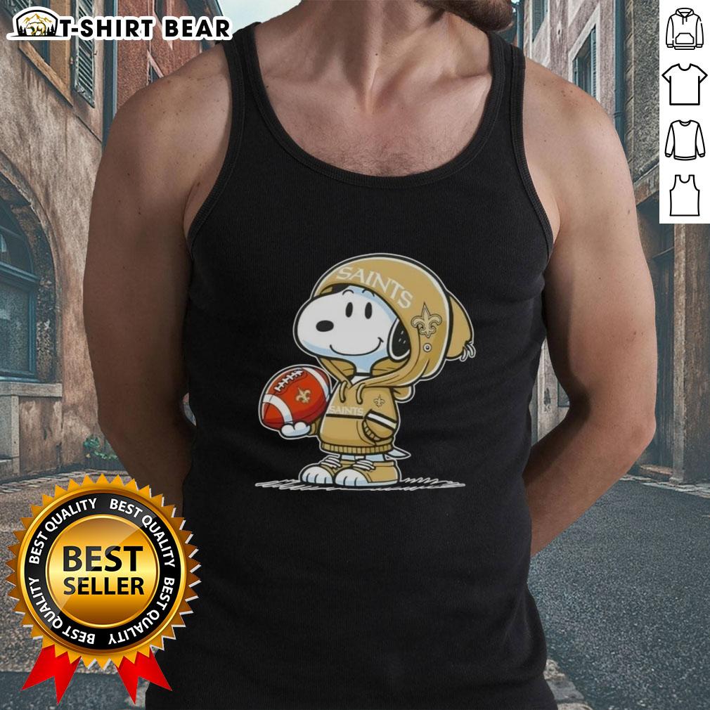 Official Peanuts Snoopy Wearing Hoodie New Orleans Saints And Smilling At Fans Tank Top Alt Text: Snoopy in a hoodie smiling at fans, showcasing his New Orleans Saints tank top, perfect for Peanuts merchandise lovers.