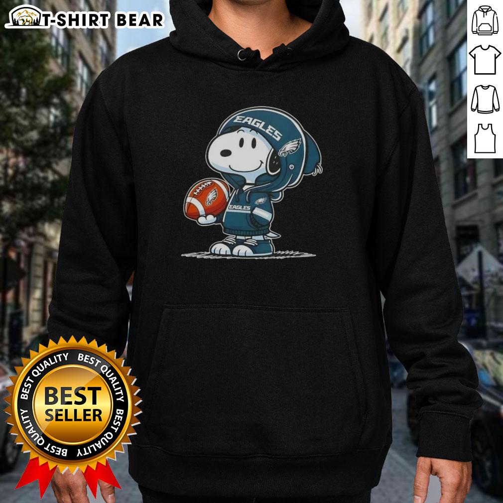 Official Peanuts Snoopy Wearing Hoodie Philadelphia Eagles And Smilling At Fans Hoodie Alt Text: Snoopy in a Philadelphia Eagles hoodie smiling at fans, showcasing official Peanuts merchandise.
