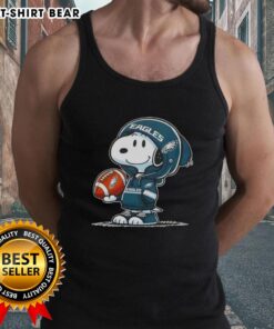 Alt Text: Snoopy in a Philadelphia Eagles hoodie, smiling at fans, featured on an official Peanuts tank top design.