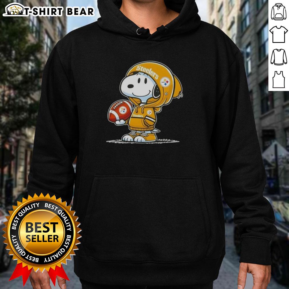 Official Peanuts Snoopy Wearing Hoodie Pittsburgh Steelers And Smilling At Fans Hoodie Alt Text: Snoopy in a hoodie, smiling at fans, showcasing his Pittsburgh Steelers spirit in this official Peanuts image.