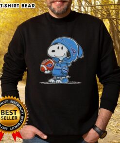 Alt Text: Snoopy in a Tennessee Titans hoodie smiles at fans, showcasing the Official Peanuts sweatshirt design.