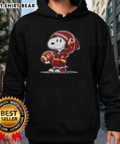 Alt Text: Snoopy in a Washington Commanders hoodie smiling at fans, showcasing official Peanuts merchandise.