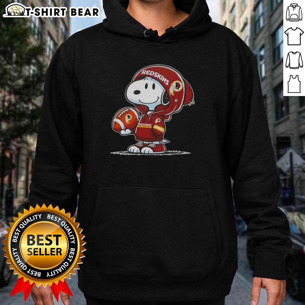Official Peanuts Snoopy Wearing Hoodie Washington Commanders And Smilling At Fans Hoodie Alt Text: Snoopy in a Washington Commanders hoodie smiling at fans, showcasing official Peanuts merchandise.