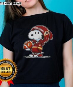 Alt Text: Snoopy in hoodie supporting Washington Commanders, smiling at fans on official ladies tee.