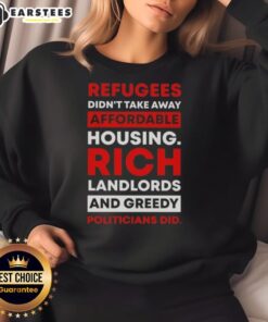 Official sweatshirt featuring the slogan 'Refugees Didn't Take Away Affordable Housing, Rich Landlords and Greedy Politicians Did.'