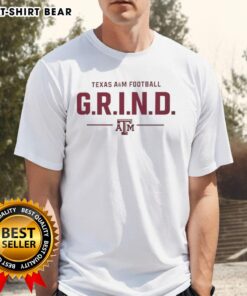 Alt Text: Original Texas A&M Football G.R.I.N.D. Logo T-Shirt featuring a bold graphic design in maroon and white colors.