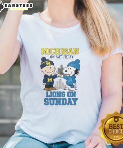 Alt Text: Premium Charlie Brown Michigan Wolverines tee for ladies, featuring Snoopy and Detroit Lions design for weekend wear.