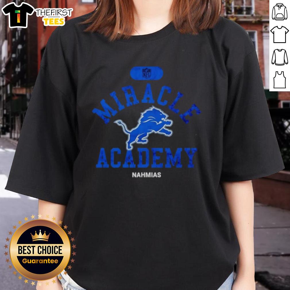premium-nfl-detroit-lions-miracle-academy-nahmias-ladies-tee Alt Text: Premium NFL Detroit Lions Miracle Academy Nahmias Ladies Tee featuring vibrant team colors and stylish design.