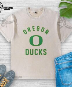 Premium Oregon Ducks washed t-shirt in green, featuring the iconic logo, perfect for fans and casual wear.