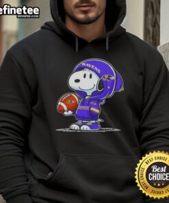 Snoopy in a hoodie smiling at fans, representing Premium Peanuts and Baltimore Ravens spirit.