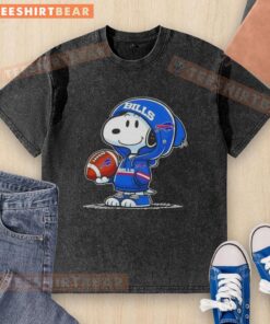 Premium Peanuts Snoopy in a Buffalo Bills hoodie, smiling at fans on a washed t-shirt, perfect for NFL enthusiasts.