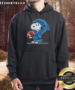 Premium Peanuts Snoopy wearing a Carolina Panthers hoodie, smiling happily at fans in a vibrant setting.