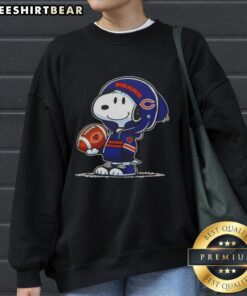Alt Text: Snoopy in a Chicago Bears hoodie smiles at fans, showcasing the Premium Peanuts sweatshirt collection.