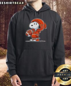 Snoopy wearing a Cincinnati Bengals hoodie, smiling at fans, showcasing premium peanuts merchandise.